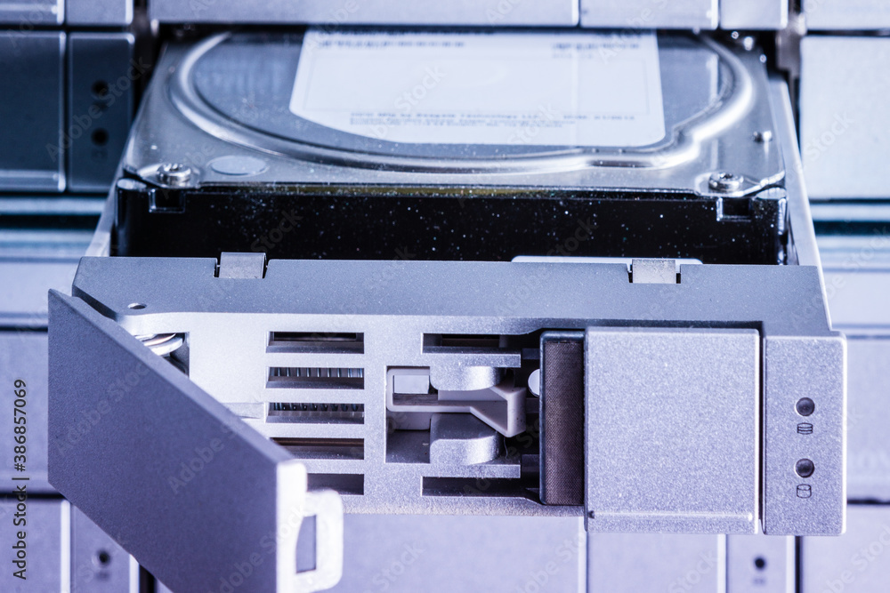 detail of hard disk in a tray that is being installed inside dat detail of hard disk in a tray that is being installed inside dat