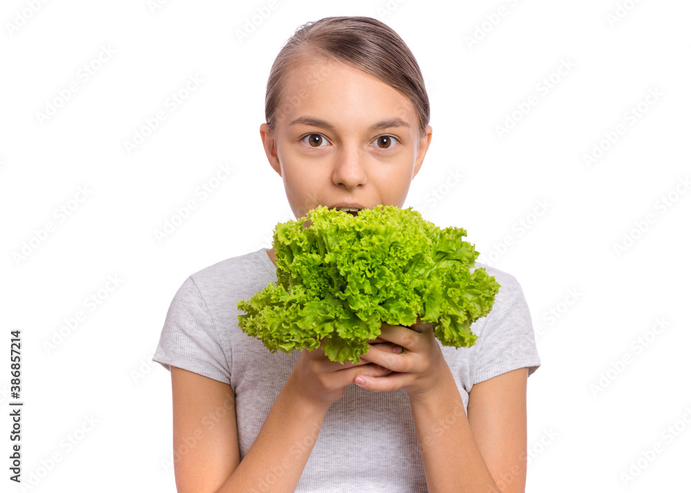 Beautiful young teen girl holding holding green salad, isolated on white background Beautiful young teen girl holding holding green salad, isolated on white background