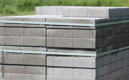 Stack of gray paving slabs. Construction of sidewalks. Building materials for the construction of the sidewalk.