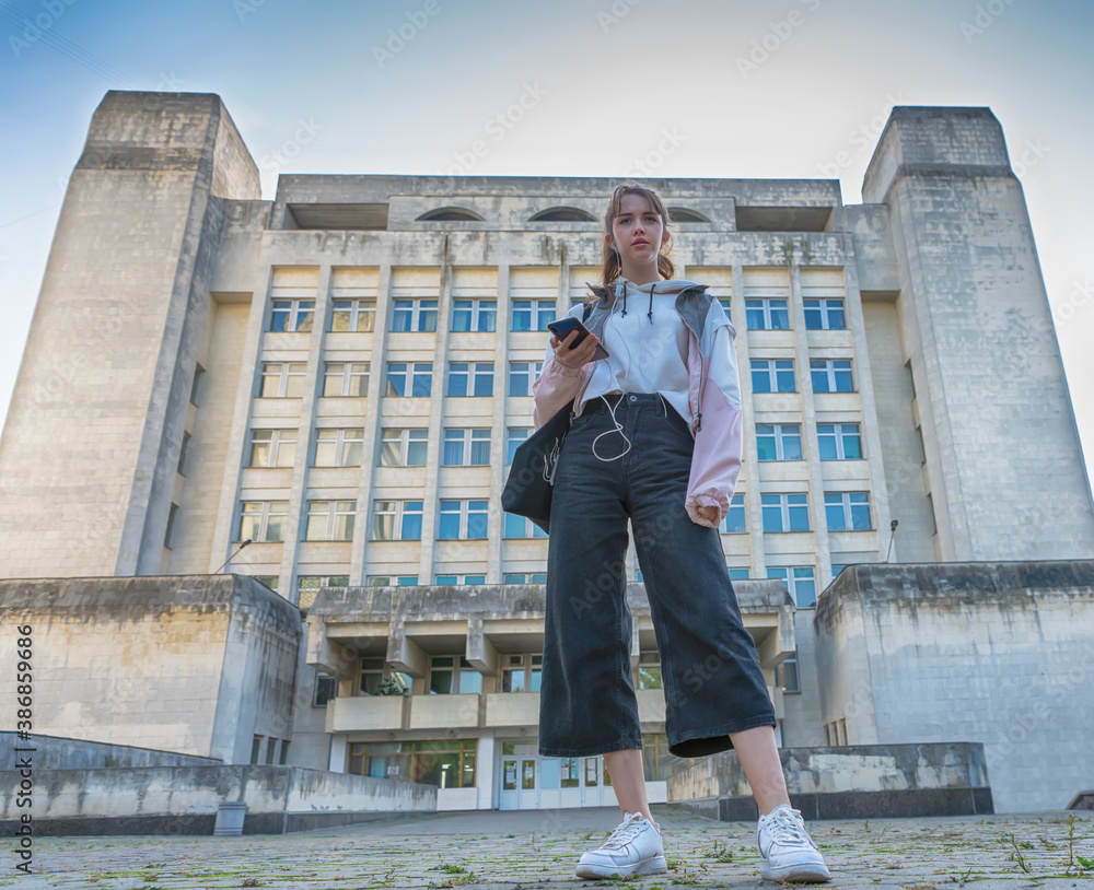 Low angle view of a trendy young college student