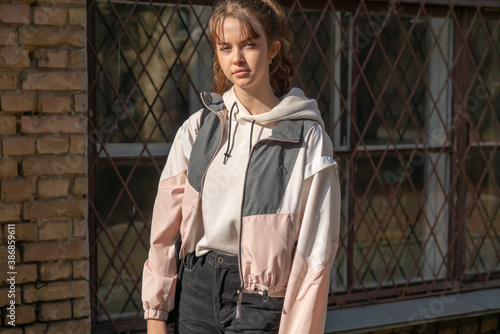 Bilde på lerret Solemn young teenage girl in evening sunshine