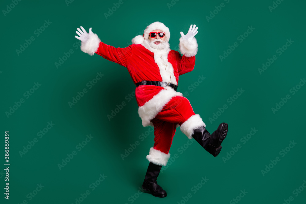 Full length body size view of his he nice attractive handsome carefree cheerful cheery Santa having fun dancing rest relax amusement celebratory festive day isolated over green color background