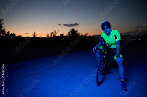triathlon athlete portrait while resting on bike training