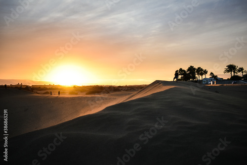 Violet and orange sunset in the sand dunes of Maspalomas, Gran Canaria. © Andrea