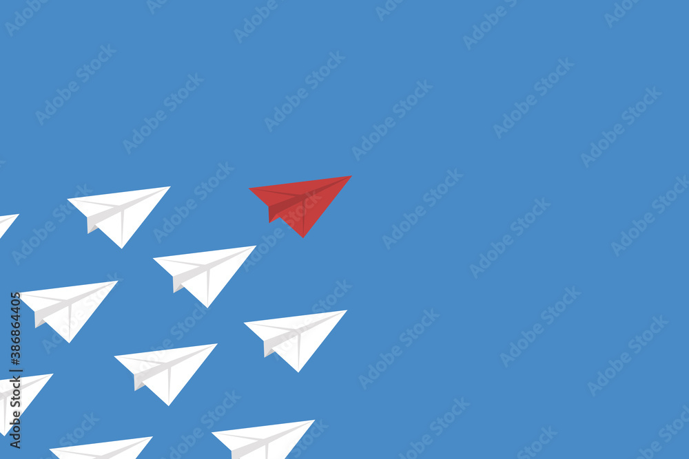Think differently concept. Red airplane changing direction. New idea, change, trend, courage, creative solution, innovation and unique way concept. Think differently concept. Red airplane changing direction. New idea, change, trend, courage, creative solution, innovation and unique way concept.