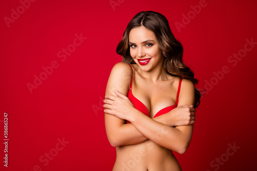 Portrait of charming attractive pretty magnificent elegant naked girl hug cuddle herself copyspace flirt enjoy tender tanned skin busty isolated bright shine color background