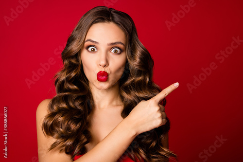 Close-up portrait of her she nice-looking attractive lovely lovable pretty funny wavy-haired girl lady vamp showing follow sale pout lips isolated over bright vivid shine vibrant red color background