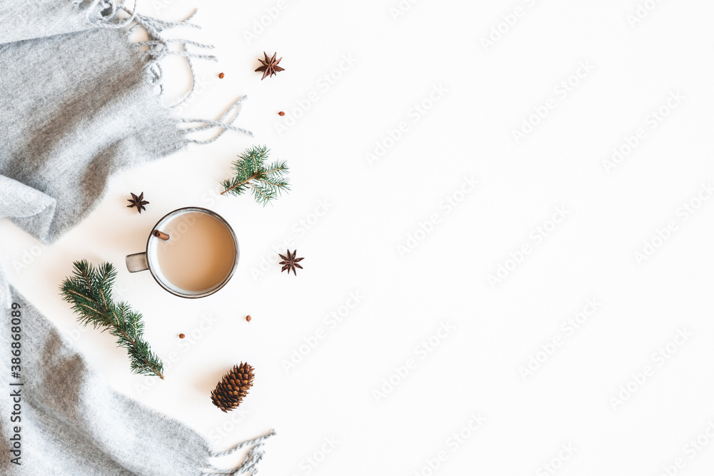 Christmas composition. Cup of coffee, fir tree branches, plaid on white background. Christmas, winter, new year concept. Flat lay, top view - obrazy, fototapety, plakaty 