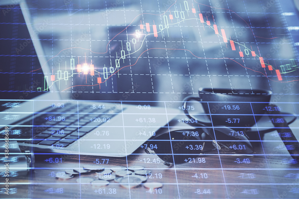 Double exposure of chart and financial info and work space with computer background. Concept of international online trading. Double exposure of chart and financial info and work space with computer background. Concept of international online trading.