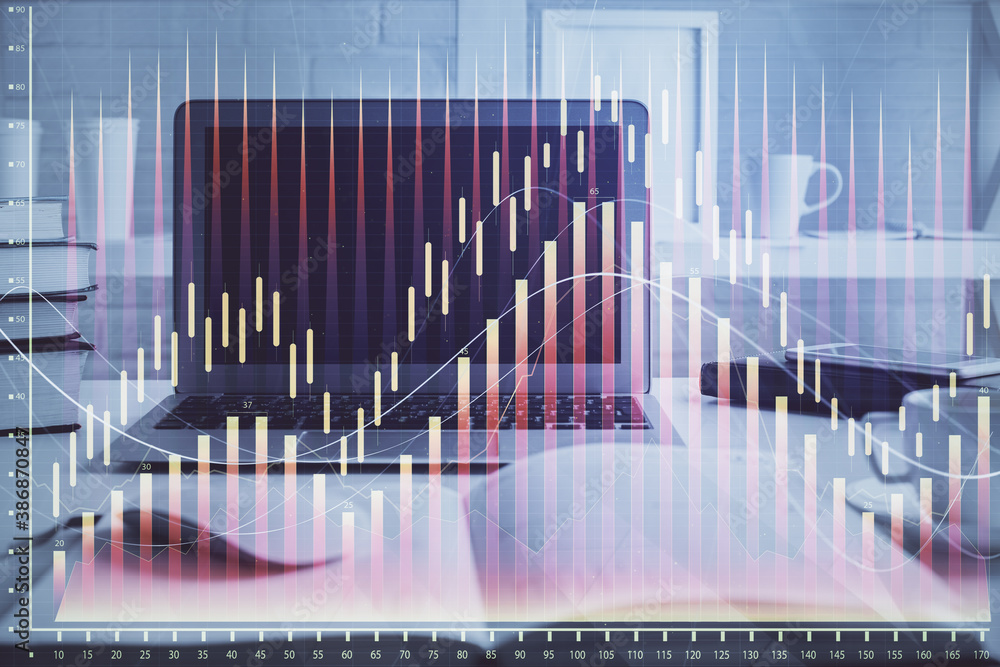 Stock market chart hologram drawn on personal computer background. Multi exposure. Concept of investment. Stock market chart hologram drawn on personal computer background. Multi exposure. Concept of investment.