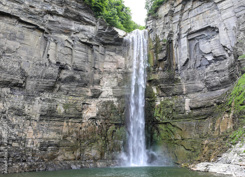 Taughannock Falls State Park in Ulysses, New York. View of the impressive 215 foot single-drop waterfall in the summer.