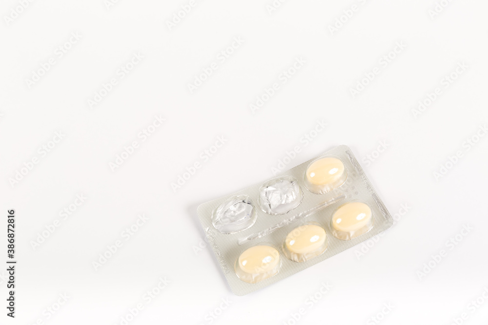 Tablets in strip over white background, vaginal antibacterial capsules Tablets in strip over white background, vaginal antibacterial capsules