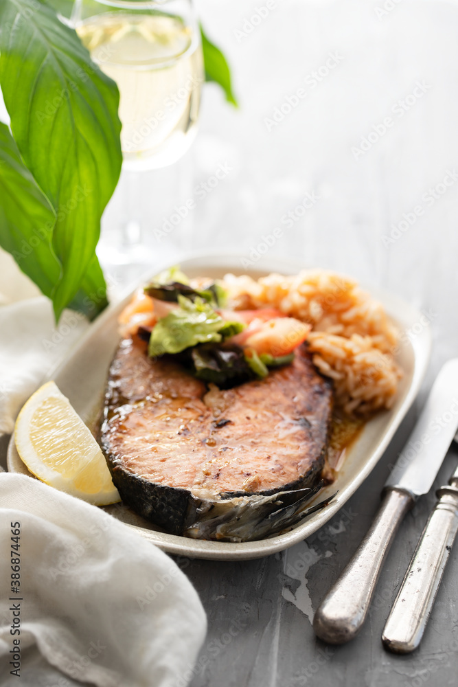 fried salmon with shrimps on white dish