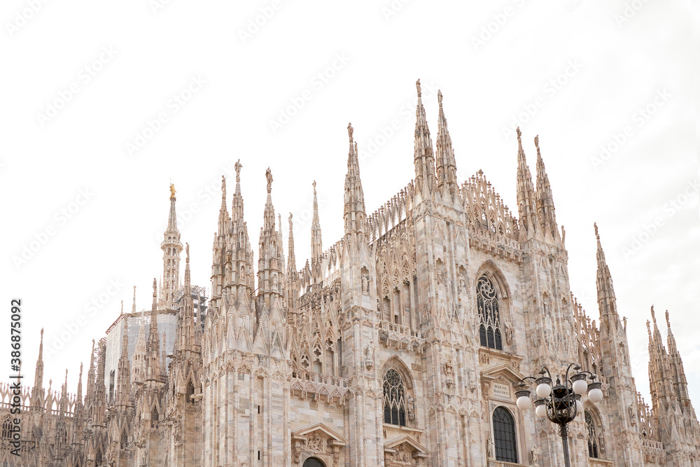 Bottom view of the historic building Duomo. Isolated on a white background. Milan, Italy. 08.2020
