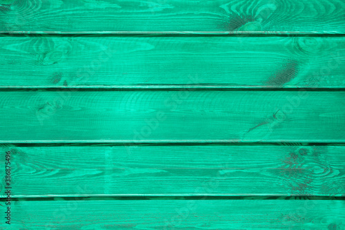 Natural wooden background painted in mint color