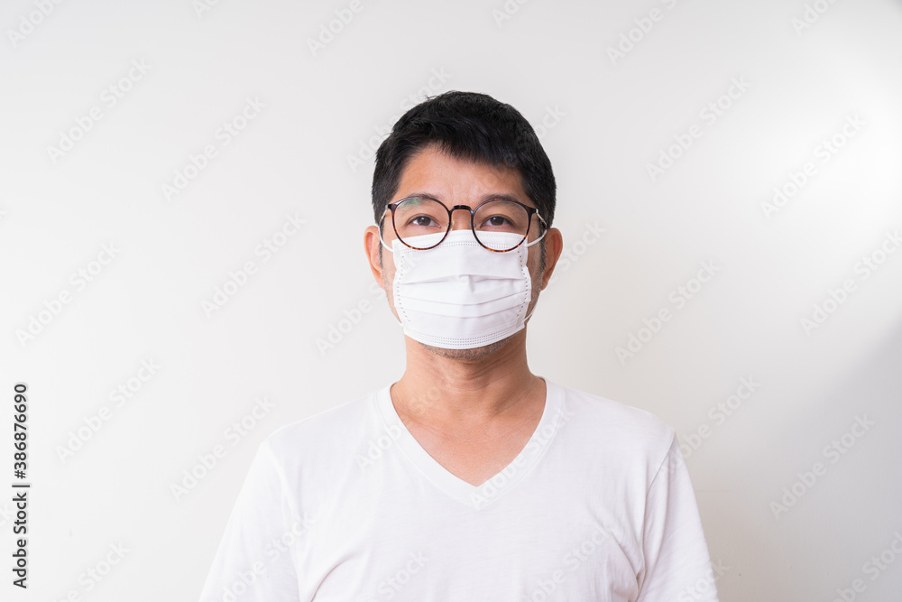 Asian man wearing surgical face mask to prevent flu disease Corona virus Asian man wearing surgical face mask to prevent flu disease Corona virus