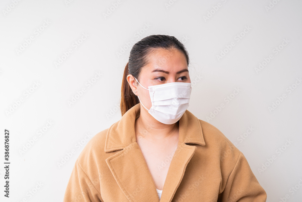 Asian women wearing surgical face mask to prevent flu disease Corona virus
