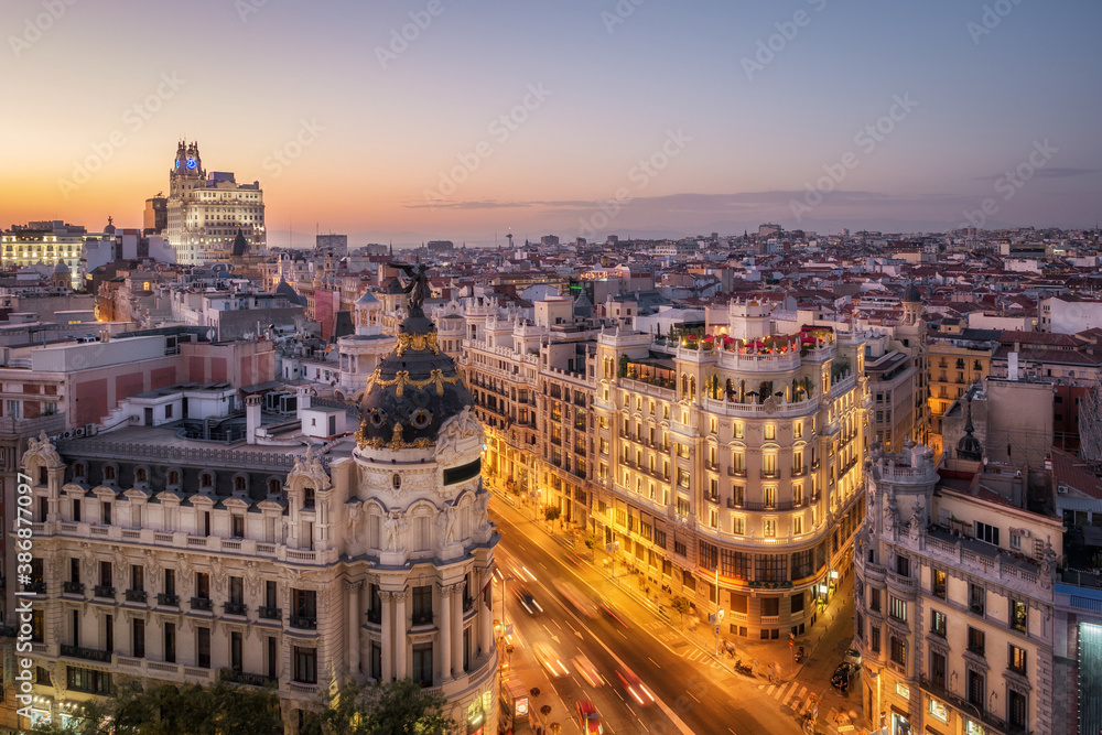 Panoramic aerial view of historic buildings on Gran Via, the famous shopping street in Madrid, capital and largest city in Spain, Europe. - obrazy, fototapety, plakaty 