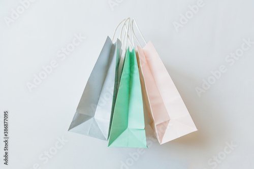 Simply minimal design three many shopping bag isolated on white background. Online or mall shopping shopaholic concept. Black friday Christmas season sale. Flat lay top view copy space, mock up