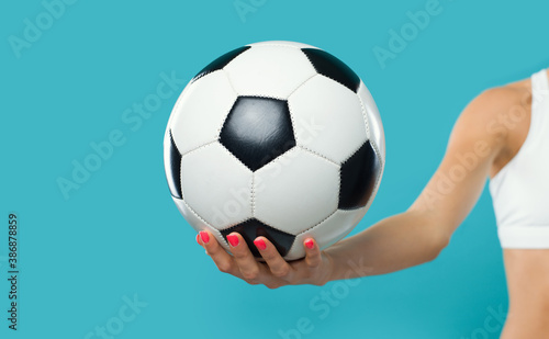 Sporty woman holding a soccer ball © StockPhotoPro