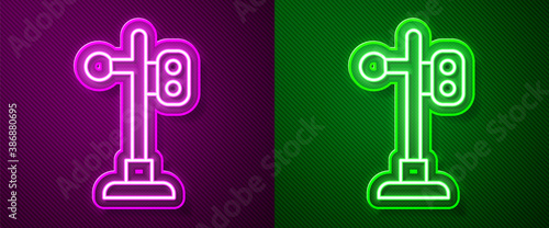 Glowing neon line Train traffic light icon isolated on purple and green background. Traffic lights for the railway to regulate the movement of trains. Vector.