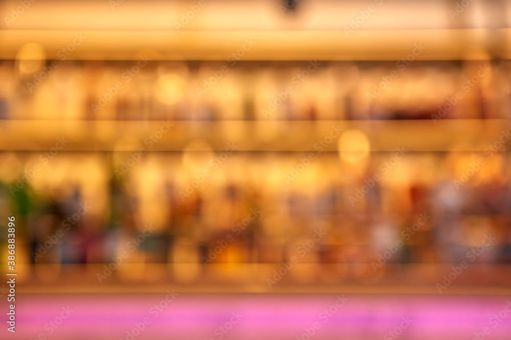 Blurred creative background of restaurant bar with pink desk space.
