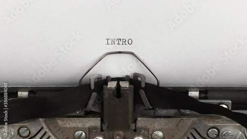 to type text intro on a vintage and old typewriter close-up
