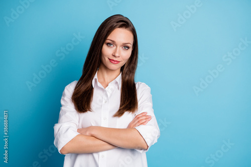 Photo of attractive business lady arms crossed friendly person wear white shirt isolated blue color background
