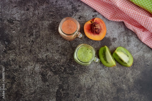 Healthy peach kiwi smoothie in jars