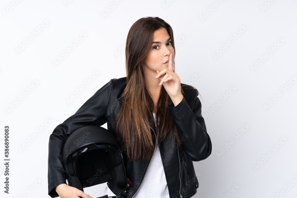 Fototapeta premium Young woman with a motorcycle helmet over isolated white background doing silence gesture