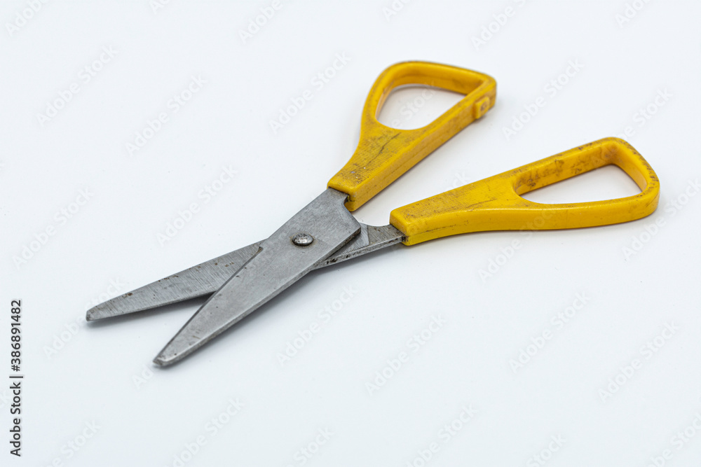 old typical yellow scissors. on white background old typical yellow scissors. on white background