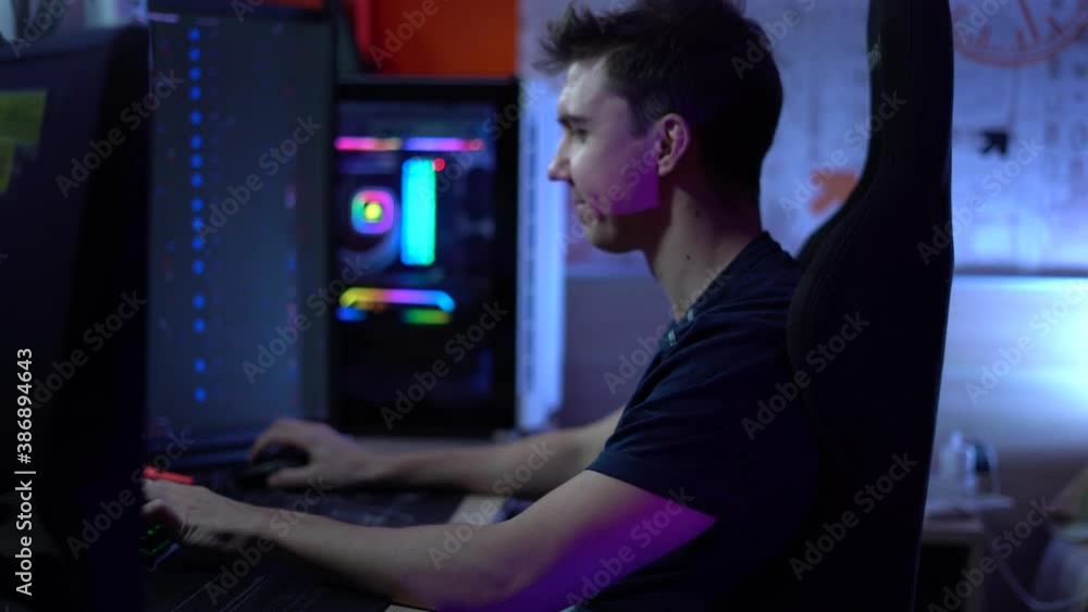 A man yawns while playing a video game . A man yawns while playing a video game .