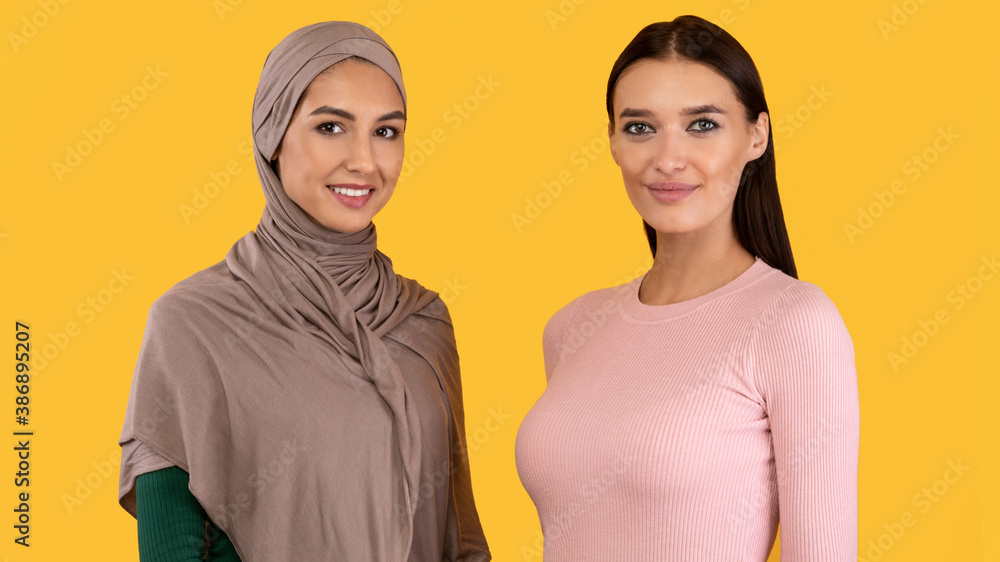 Muslim Women Posing Wearing Hijab And Modern Clothes In Studio Muslim Women Posing Wearing Hijab And Modern Clothes In Studio