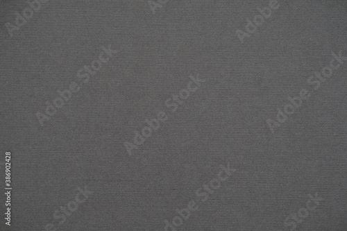 Dark gray paper texture with noise and cross stripes. Rough background texture. Template, blank for the presentation.