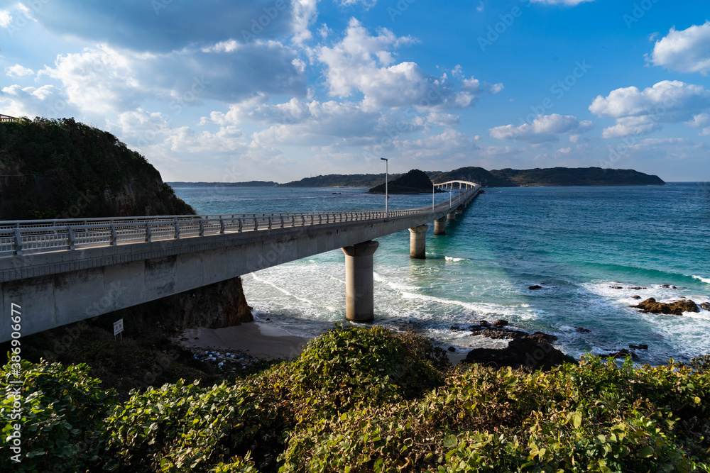 bridge crosses the sea to the island in Japan.
