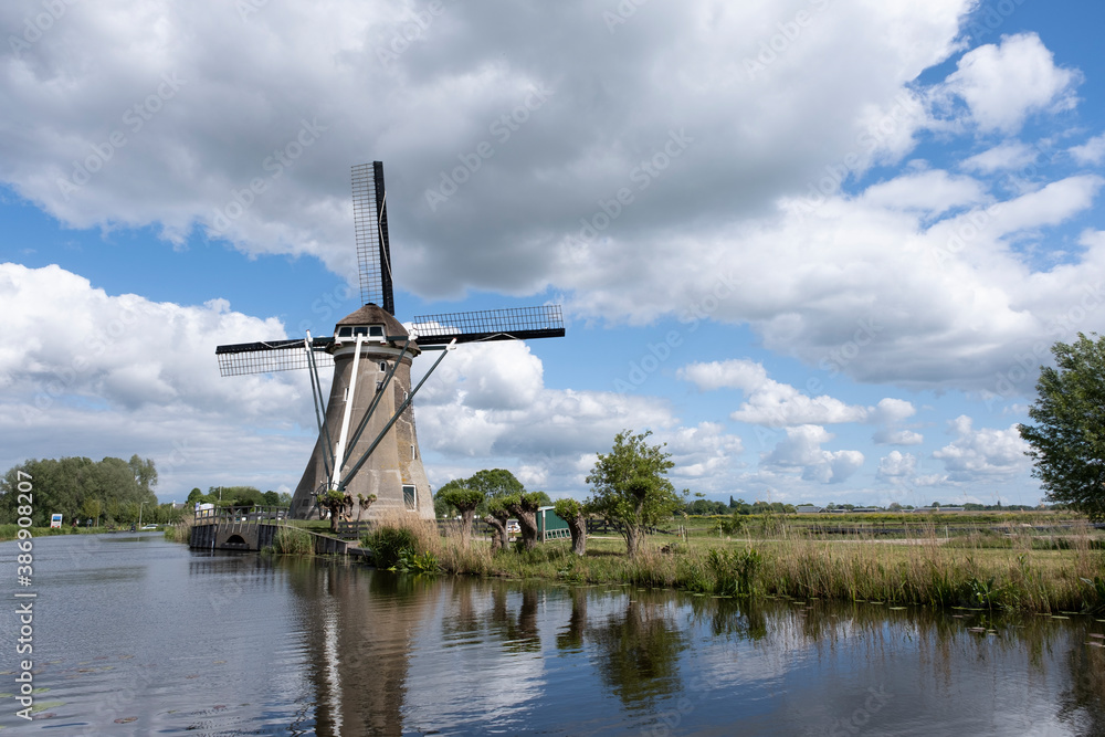 Traditional setting of the historical dutch windmills landscape at the Netherlands, an UNESCO world heritage site