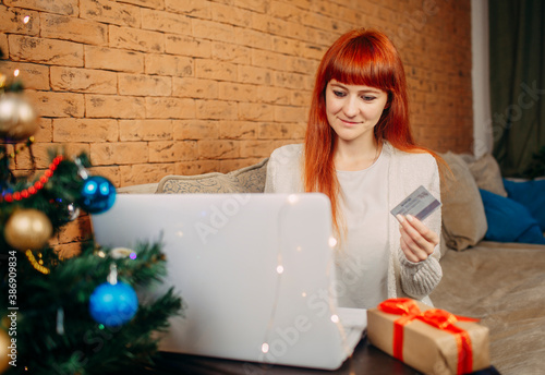 red hair girl ordering christmas gifts online © Dontsov