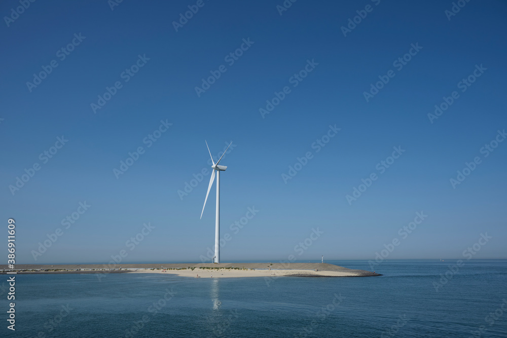 Windmill on the coast of the Netherlands producing renewable energy for a sustainable future