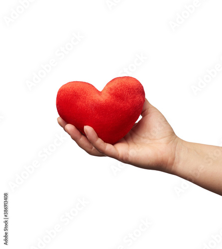 female hand holds red textile heart, white background