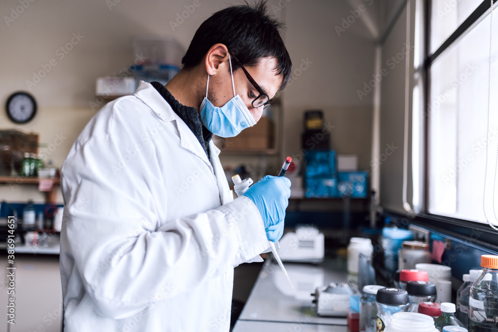 Male Scientist Working in Laboratory Male Scientist Working in Laboratory