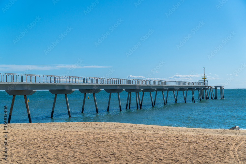 Badalona, Catalonia / Spain - October 3rd, 2020: The Petroleum Bridge as seen from below in a sunny day