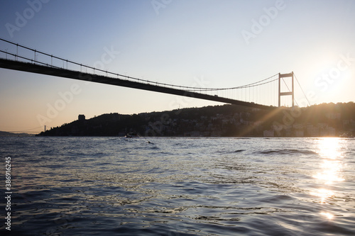 istanbul bosphorus from the sea during sunset under fatih sultan mehmet bridge