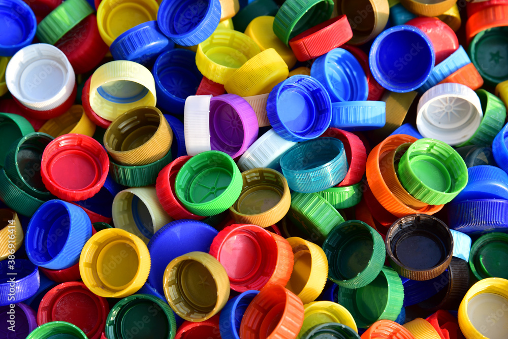 Plastic bottle caps background Cap material is recyclable Remove lids Plastic bottle caps background Cap material is recyclable Remove lids