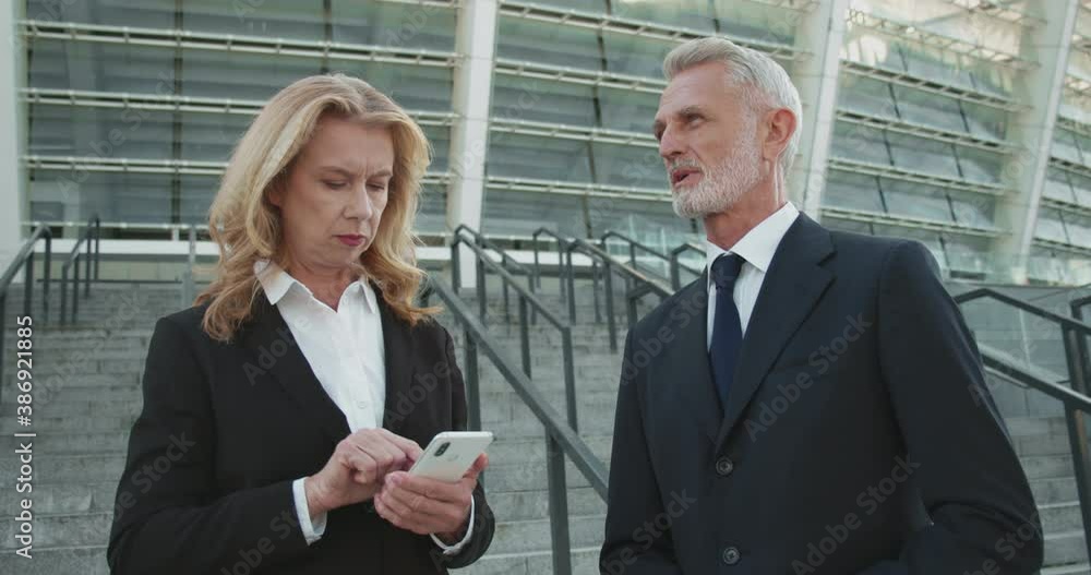 Busy company ceo giving instructions to responsible female secretary, delegation Busy company ceo giving instructions to responsible female secretary, delegation