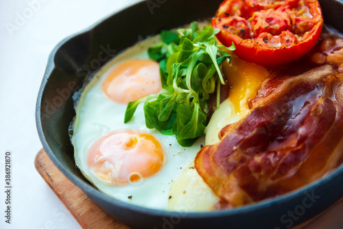 classical english breakfast with egg and ham