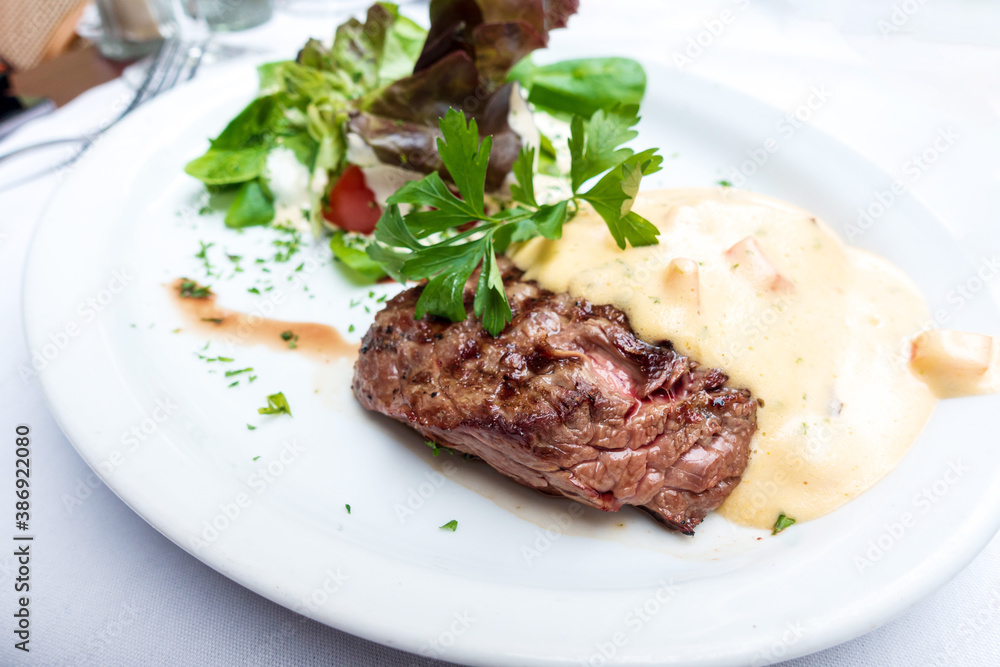 juicy steak beef meat with tomato and potatoes juicy steak beef meat with tomato and potatoes
