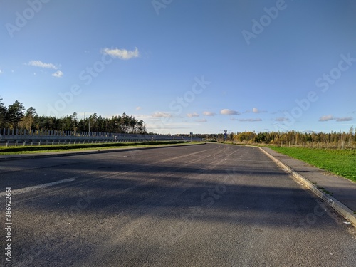 empty highway and blue sky in the autumn season