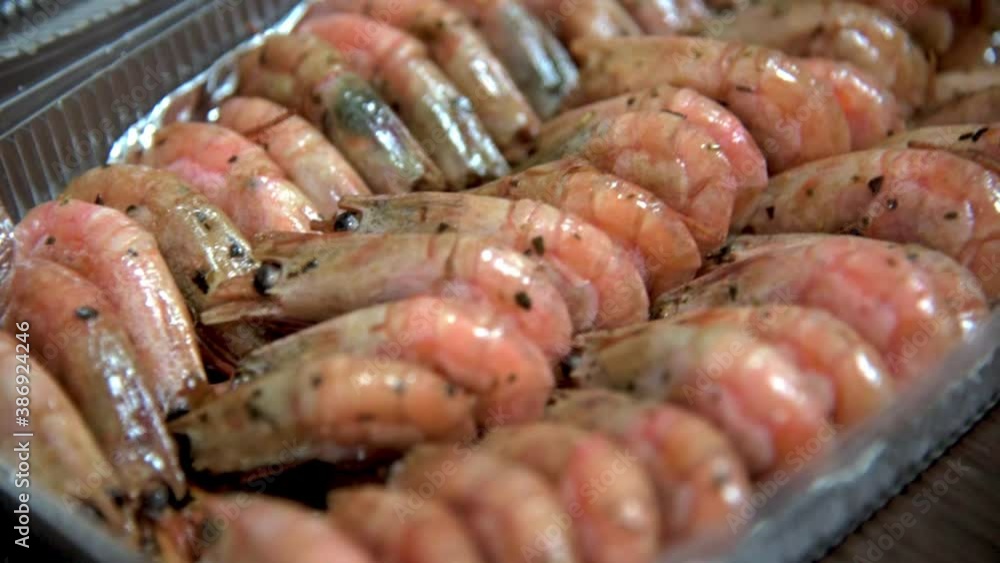 Fried prawns on foil in plastic box on table in restaurant kitchen. HD Fried prawns on foil in plastic box on table in restaurant kitchen. HD