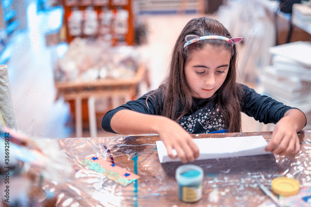 Fototapeta premium Young girl making diy work at home