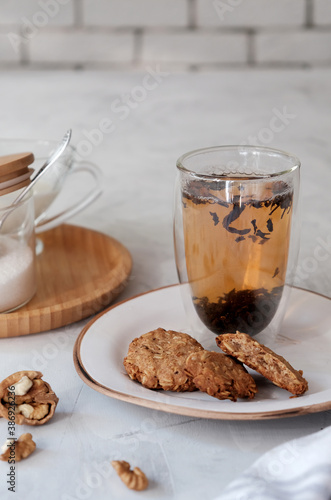 Cozy homemade oatmeal cookies and a cup of tea.
